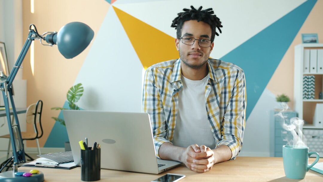 writer at desk with lamp