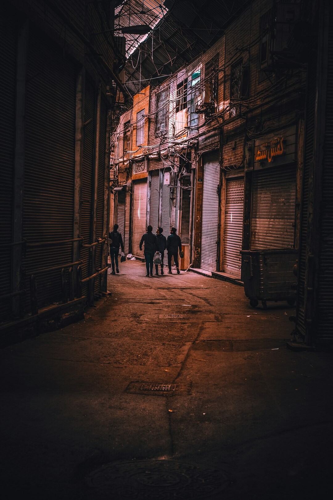 two men arguing in dark alley